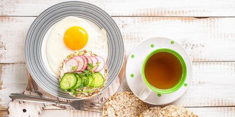 Toast with cheese, a cucumber and a garden radish