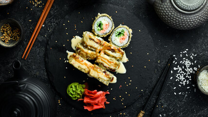 Sushi rolls on a stone plate. Close-up. Japanese food.
