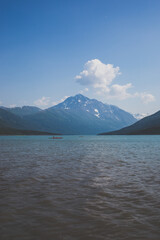 Red kayak on Alaska mountain lake