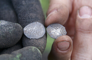 English middle age coins in finders hands