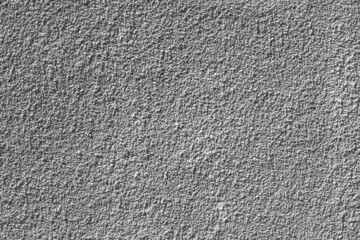 Painted wall with rough texture closeup. Grey plaster with brushed texture, house wall, copy space