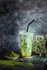 Iced green tea in a plastic glass with ice