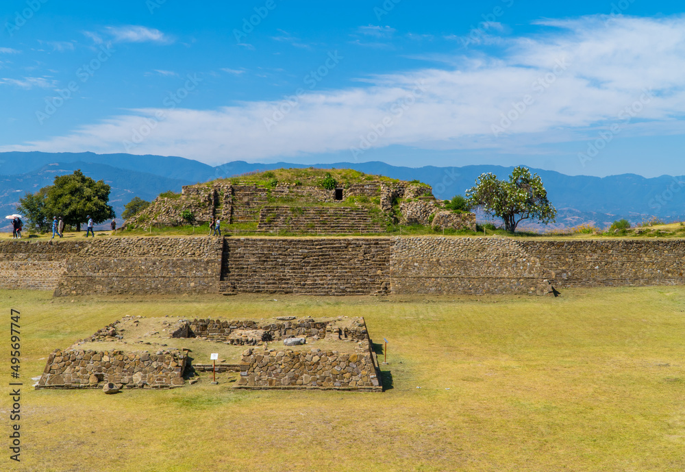 Poster photo of tourists and temples in the zapotec monte alban archaeological zone in oaxaca, mexico