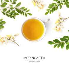 Creative layout made of moringa tea on the white background. Flat lay. Food concept. Macro  concept.