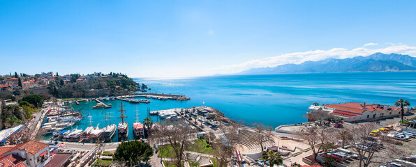 View of Antalya Old City Harbor, the Taurus Mountains and the spelling of the Mediterranean Sea