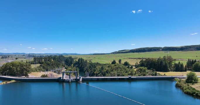 Flight reverses from hydro electric dam back across lake on gorgeous day-NZ