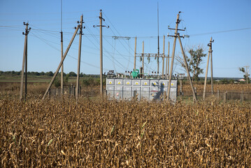 Transformers - electrical substation on an agricultural field.