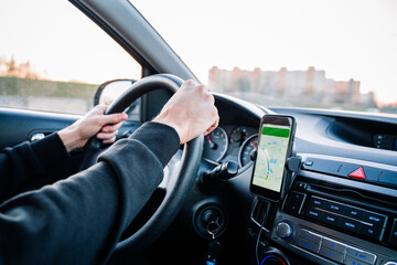 Gps device map system. Global positioning system on smartphone screen in auto car on travel road....