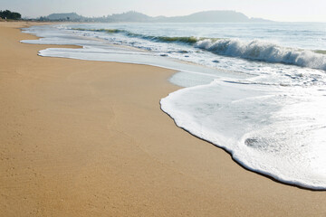 Soft wave of ocean on sandy beach