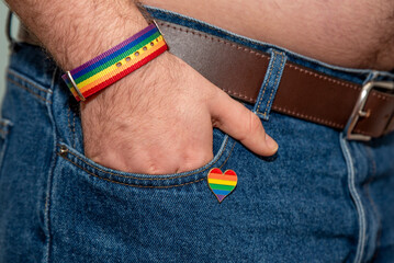 cause up of man wearing rainbow badge
