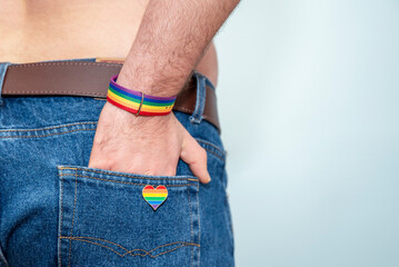 cause up of man wearing rainbow badge