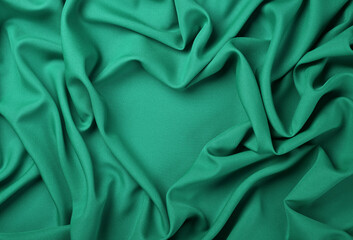 Teal heart shape textile fold pleats background