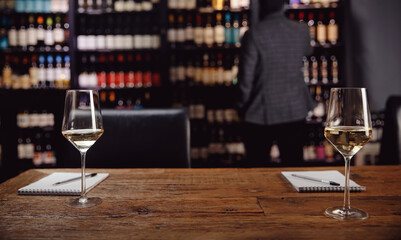 Concept experts tasting new sorts of white wine wooden table
