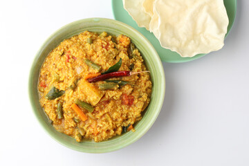 South Indian traditional vegetarian rice dish, bisi bele bath, Sambar rice with rice and pigeon pea as the main ingredients.