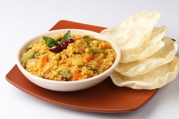 South Indian traditional vegetarian rice dish, bisi bele bath, Sambar rice with rice and pigeon pea as the main ingredients.