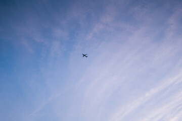 Little plane on a background of the blue summer sky.