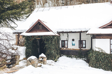 Wooden textured house in Spania Dolina, Slovakia in winter - obrazy, fototapety, plakaty