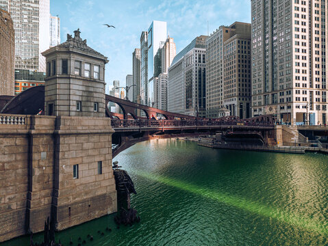 One of the many drawbridge's spanning the Chicago River with a bird in flight.