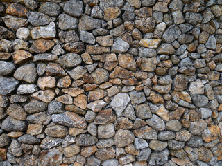 The walls are made of stacked stones.
