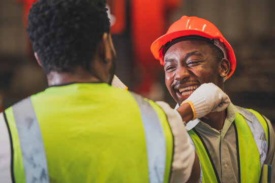 Teamwork African American worker in the factory.Black man afro work heavy industrial