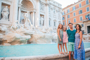 Family near Fontana di Trevi, Rome, Italy. - 495715753
