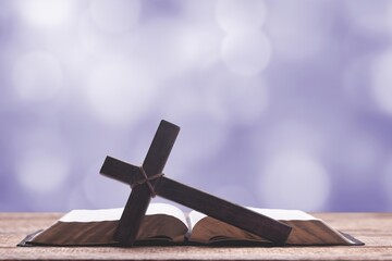 Holy and Good concepts. Wooden cross with open book