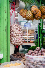 stacked vegetables in paloquemado market square of Bogota_Colombia (garlic)