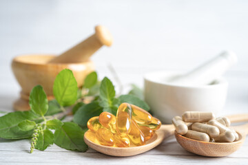 Alternative medicine herbal organic capsule drug with herbs leaf natural supplements for healthy good life.