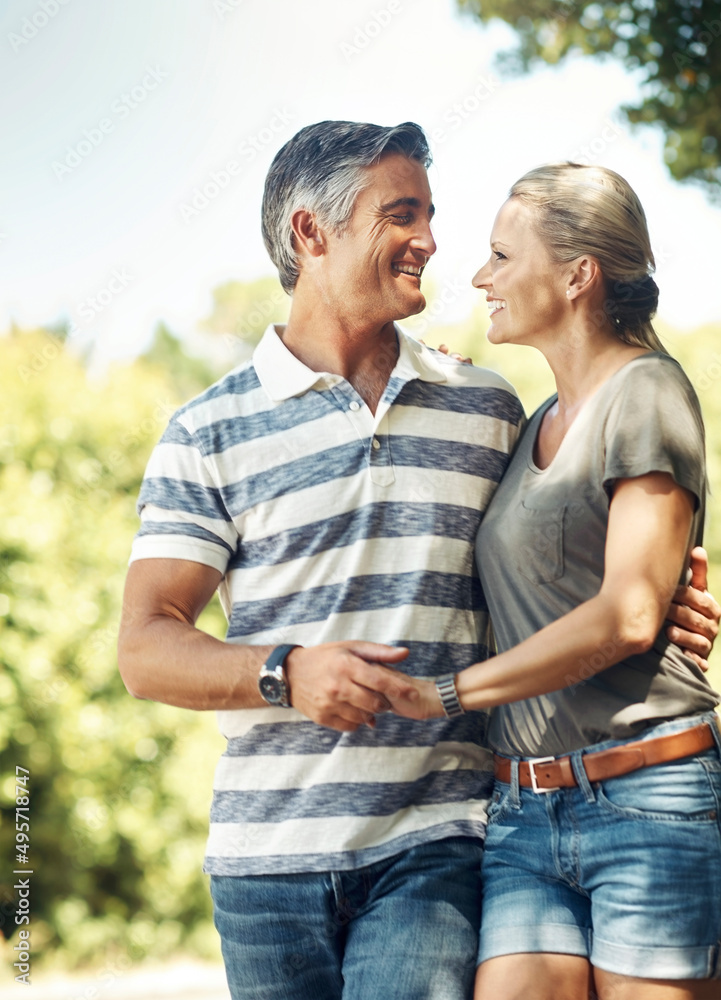 Poster committed and content. cropped shot of an affectionate mature couple enjoying a day in the park.