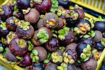 typical colombian fruits stacked in market place
