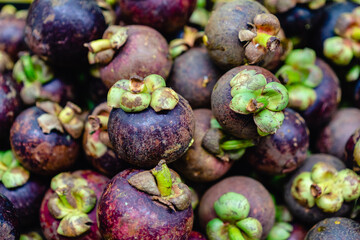 typical colombian fruits stacked in market place
