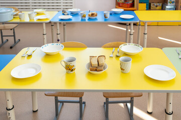 Lunch at a kindergarten in Russia. Table setting before meals.