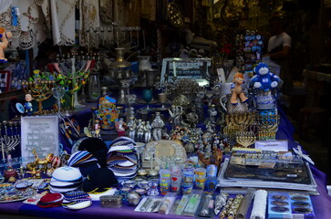 Carmel Market. Israeli souvenir market. Showcase in a tourist shop. Hansa, Eye of Fatima (Nazar),...