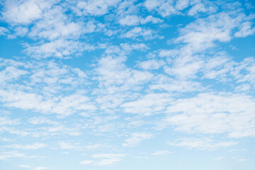 The blue sky covered with white clouds