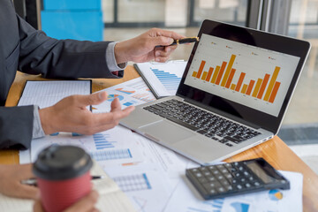 Business adviser analyzing financial figures denoting the progress Internal Revenue Service checking document. Audit concept