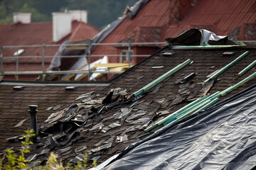 Storm damaged roof, destroyed roof tiles, expensive damage needing prompt repair