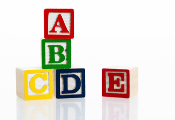 Alphabet ABCDE blocks on white background