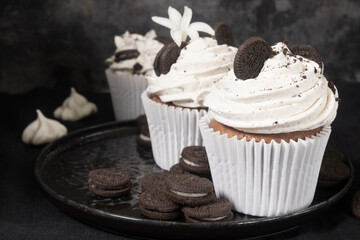 Chocolate cupcake with cream and Oreo cookies