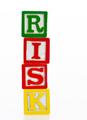 Word risk writing with wooden blocks