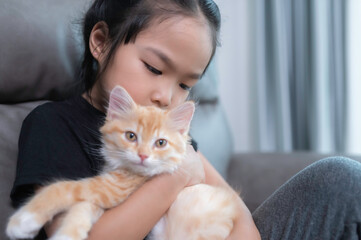 Asian girl with her cute cat,She play with kitten