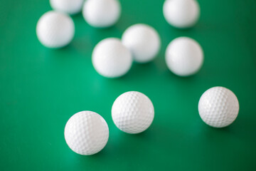 Golf balls on the green background