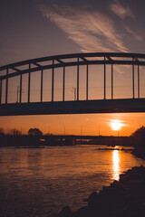 Vertical shot of the Hendrix bridge over the river at the sunset in Croatia, Zagreb