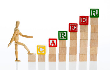 Puppet climbing wooden block stairs