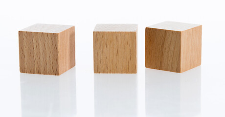 Three wooden blocks on white background
