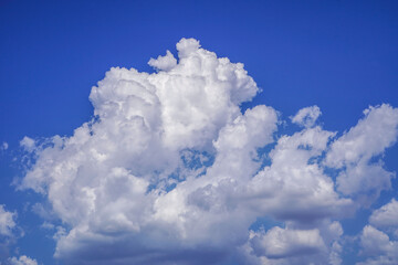 Blue sky with white clouds. Sky and clouds during the daytime in the summer. white fluffy clouds in the blue sky.