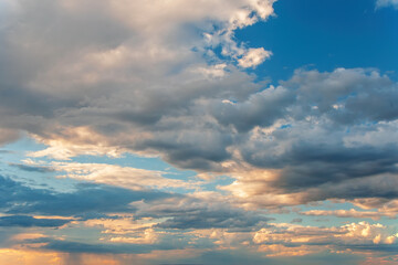 Majestic clouds burning by sunset. Sky background
