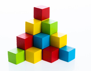 Fototapeta na wymiar Pyramid of blocks on white background
