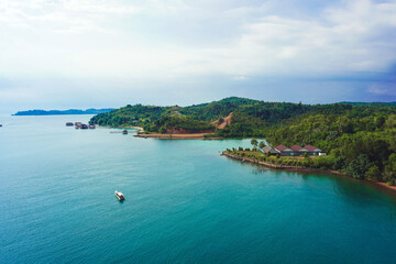 Mesmerizing scene of the magic blue water in the Islands in Batam, Indonesia against a cloudy sky