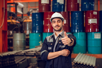 Smart factory worker engineering manager working at industrial worksite , wearing hard hat for safety