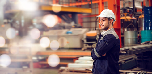 Smart factory worker engineering manager working at industrial worksite , wearing hard hat for...